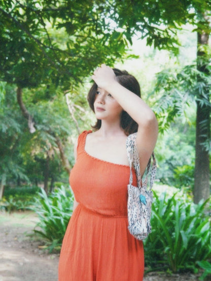 Urnisha in Orange shower jumpsuit